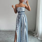 👗 NU 49% KORTING! 💥 Geometrische jumpsuit met halterhals en zijsplit – Unieke print en elastische achterkant – Veelzijdig, perfect voor zomerfeestjes of als resortkleding ✨