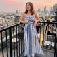 👗 NU 49% KORTING! 💥 Geometrische jumpsuit met halterhals en zijsplit – Unieke print en elastische achterkant – Veelzijdig, perfect voor zomerfeestjes of als resortkleding ✨