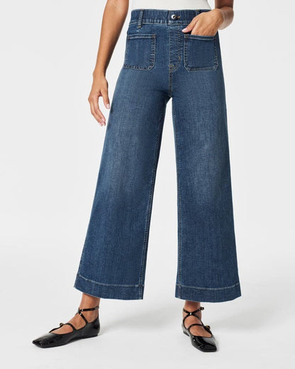 Jeans met wijde pijpen en buikplooi