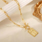 Kruis hangertje met paperclip-ketting